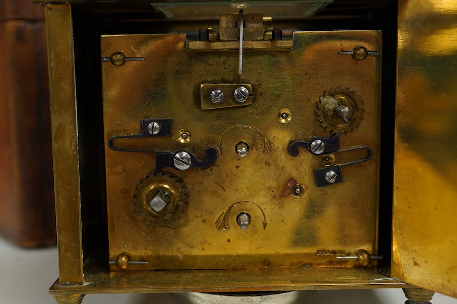A cased French brass carriage timepiece with alarm, 12cm high